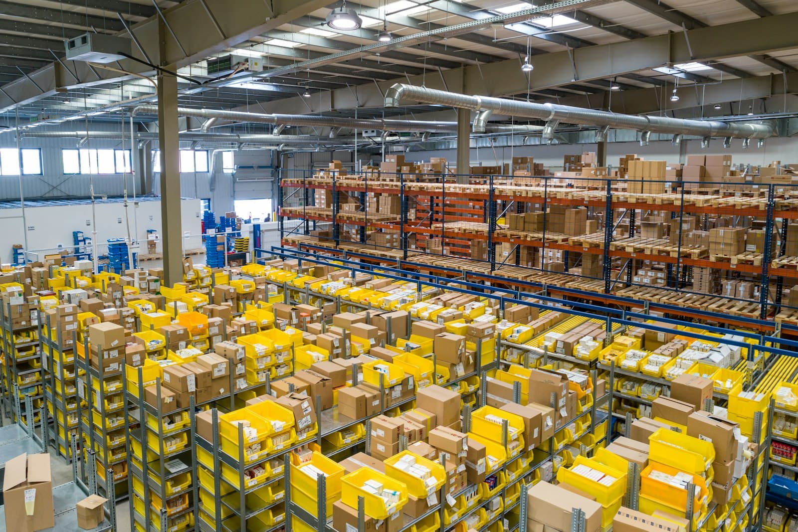 High-bay warehouse with rows of FBA-bound totes