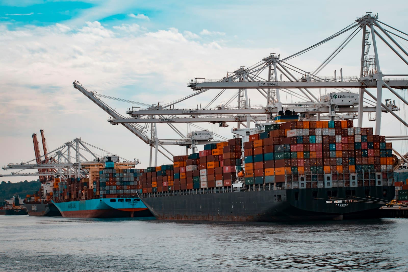 Container port crane loading goods for return shipment